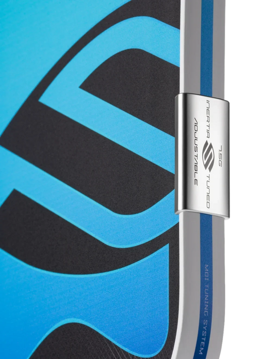 Close-up of the Pickleshop Selkirk Omni pickleball paddle showing the adjustable MOI tuning system weight on the edge