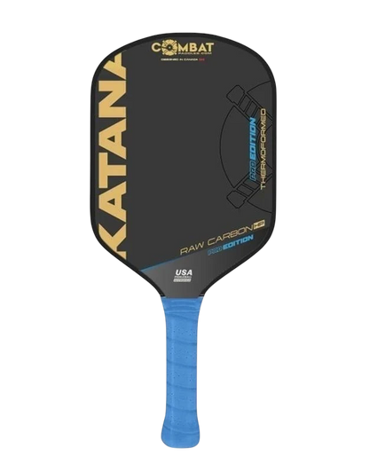 Pickleshop Combat Katana PRO Raw Carbon paddle with blue grip and black face, featuring 'PRO EDITION' and 'THERMOFORMED' text.