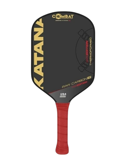 Pickleshop Combat Katana PRO Raw Carbon pickleball paddle with a red grip and black face featuring gold lettering.