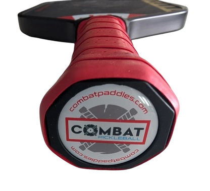 Pickleshop Combat Titan Foam Pro pickleball paddle handle with red grip and Combat Pickleball branded butt cap