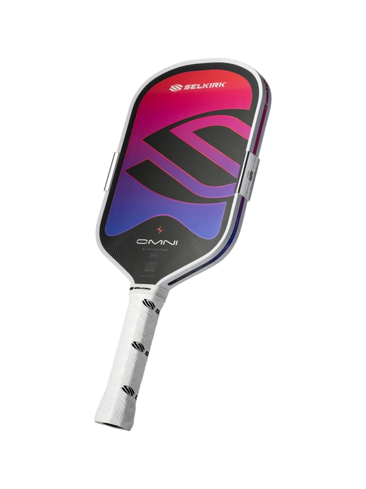 Pickleshop Selkirk Omni elongated pickleball paddle with a vibrant pink and purple gradient face and white grip.