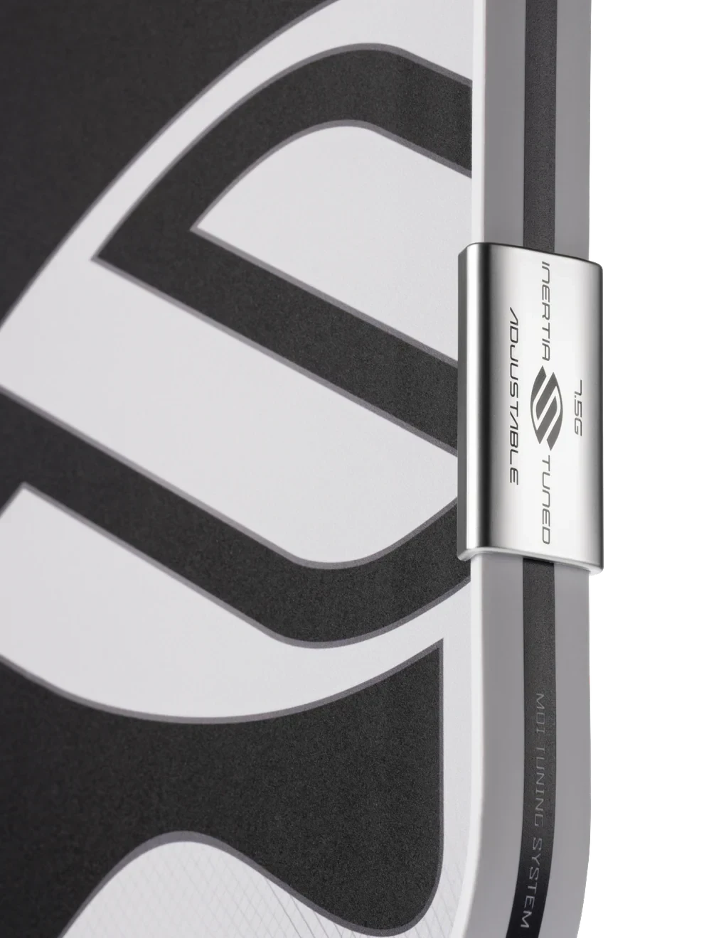 Pickleshop Selkirk Omni pickleball paddle edge showing the adjustable MOI tuning system weight on a black background