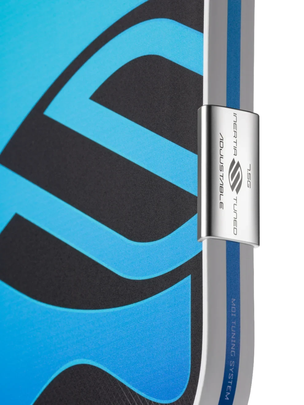 Close-up of the Pickleshop Selkirk Omni pickleball paddle showing the adjustable MOI tuning system weight on the edge