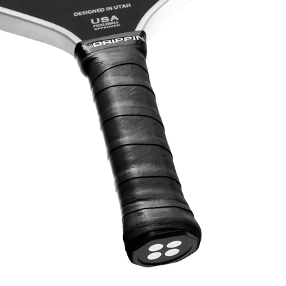 Pickleshop Udrippin Pro Tour black pickleball grip with extra tackiness and sweat-absorbent material.